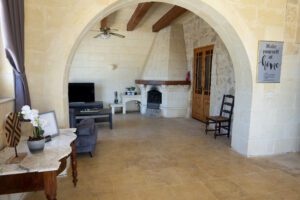 Living Room with Fireplace inside Nirvana Self Catering Farmhouse in Gozo